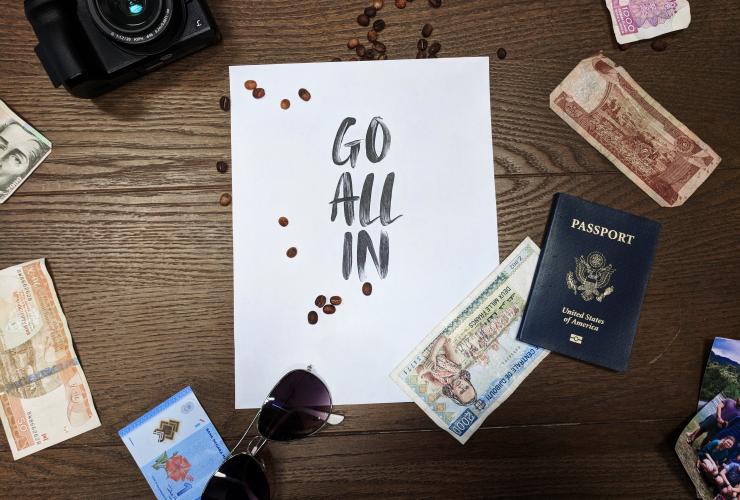 go all in sign with passport money camera around