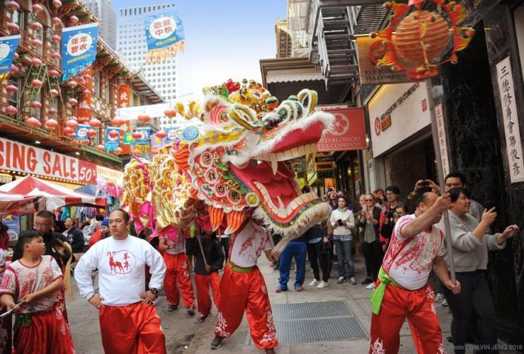dragon parade with men in chinatown