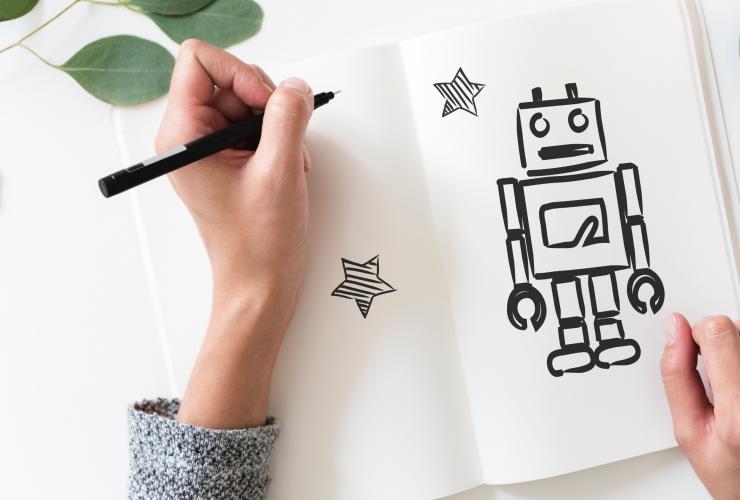 Come practice your drawing at the CJM hand drawing robot on paper sketchbook