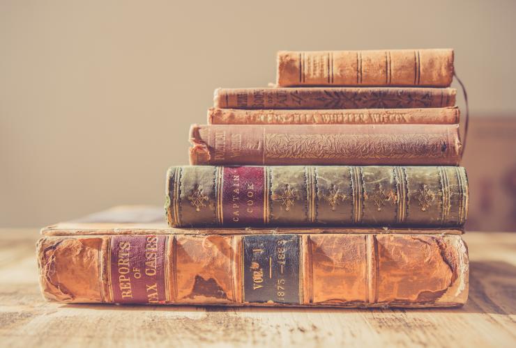 stack of old antique books