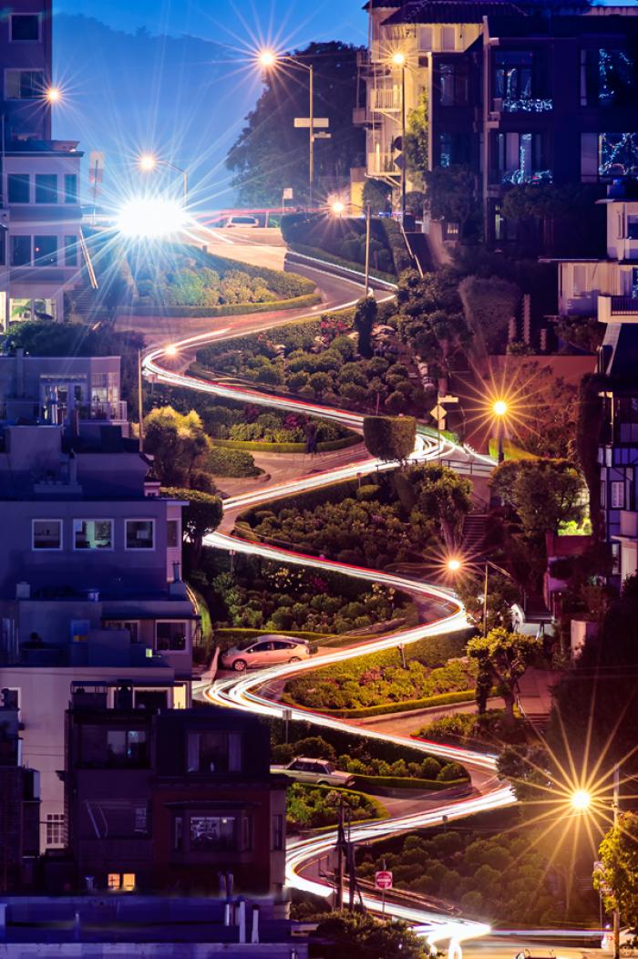 A time lapse photo of Lombard Street at night